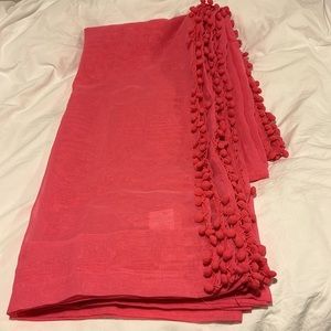 Hot pink curtain panels with pom poms